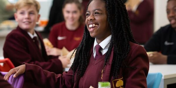 Student laughing in canteen