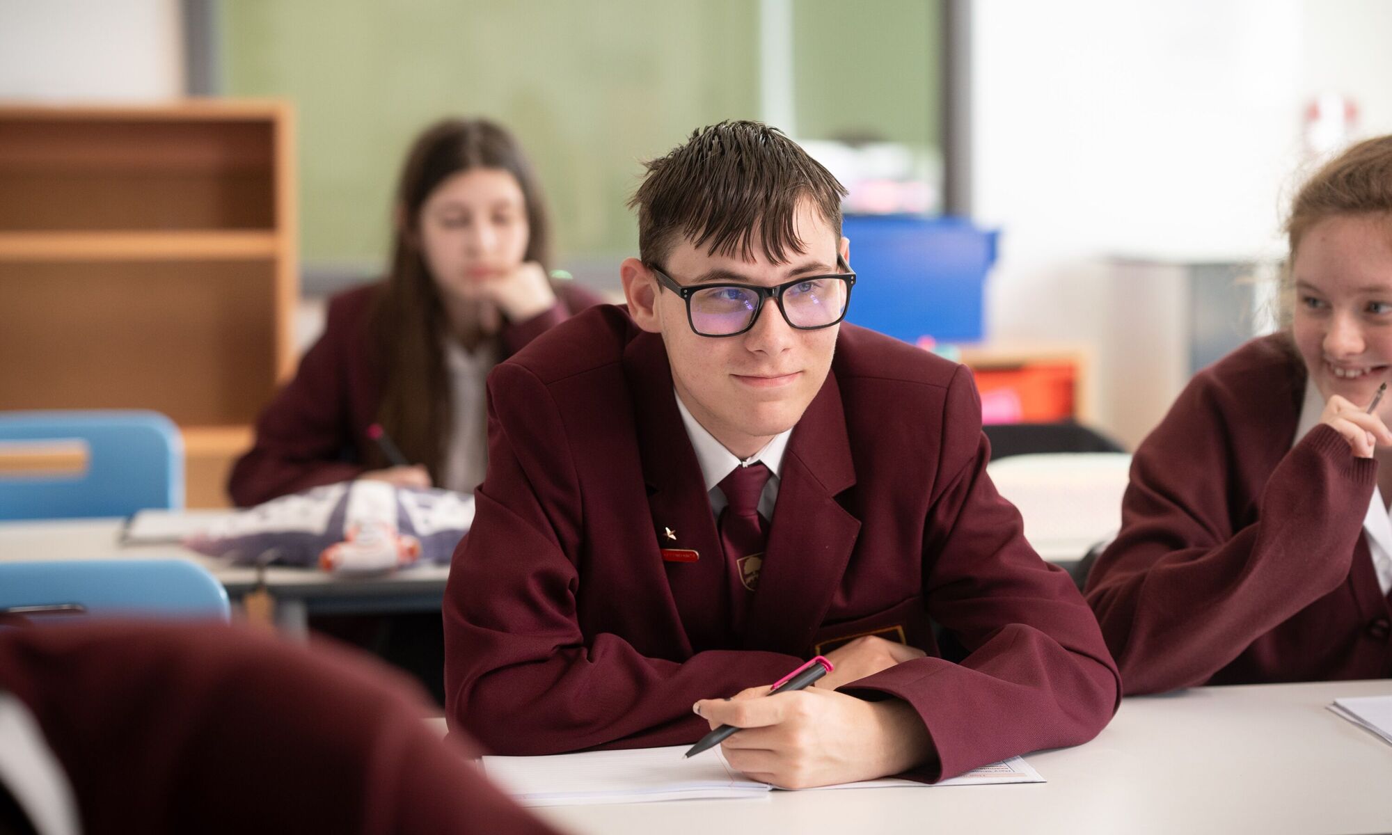 Male student sat at desk